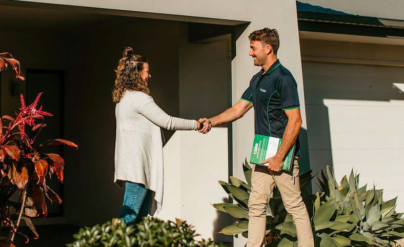 air conditioner installer giving free quote to a home owner