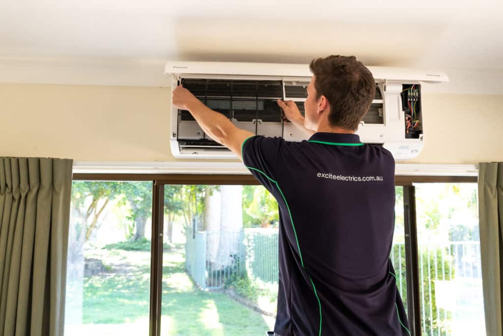 split system air conditioner repairs being conducted on home unit in Sunshine Coast