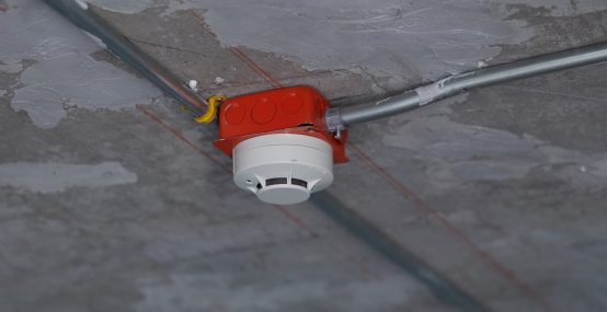 Smoke detector on precast concrete ceiling — Electricians in Warana QLD