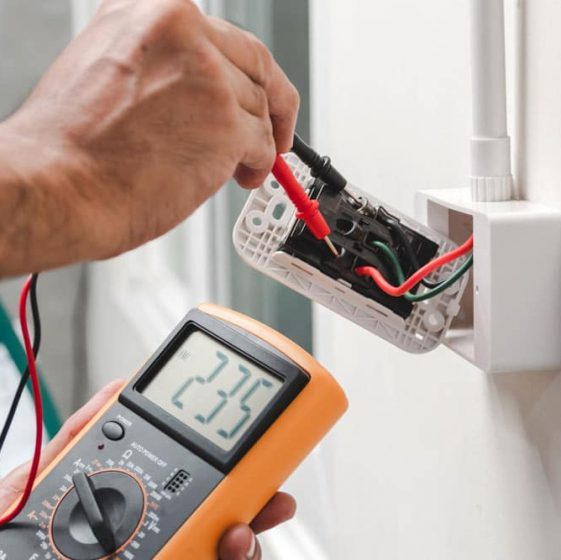 Electrician is using a digital meter — Property Management in Warana QLD