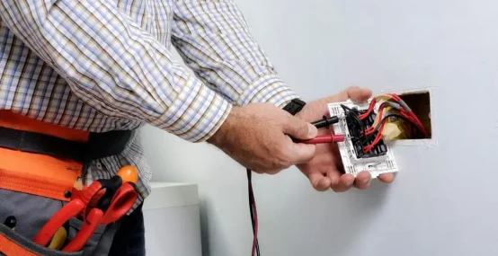 Electrician at work on switches and sockets — Electrician Sunshine Coast QLD