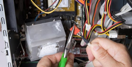 Electrician adjusting wire — Electricians in Warana QLD
